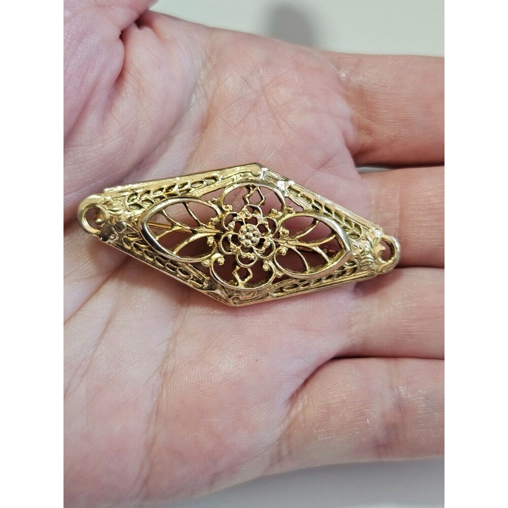 1928 brand gold tone brooch